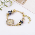 Bracelet Style Quartz Watch with Charms and Adjustable Closure